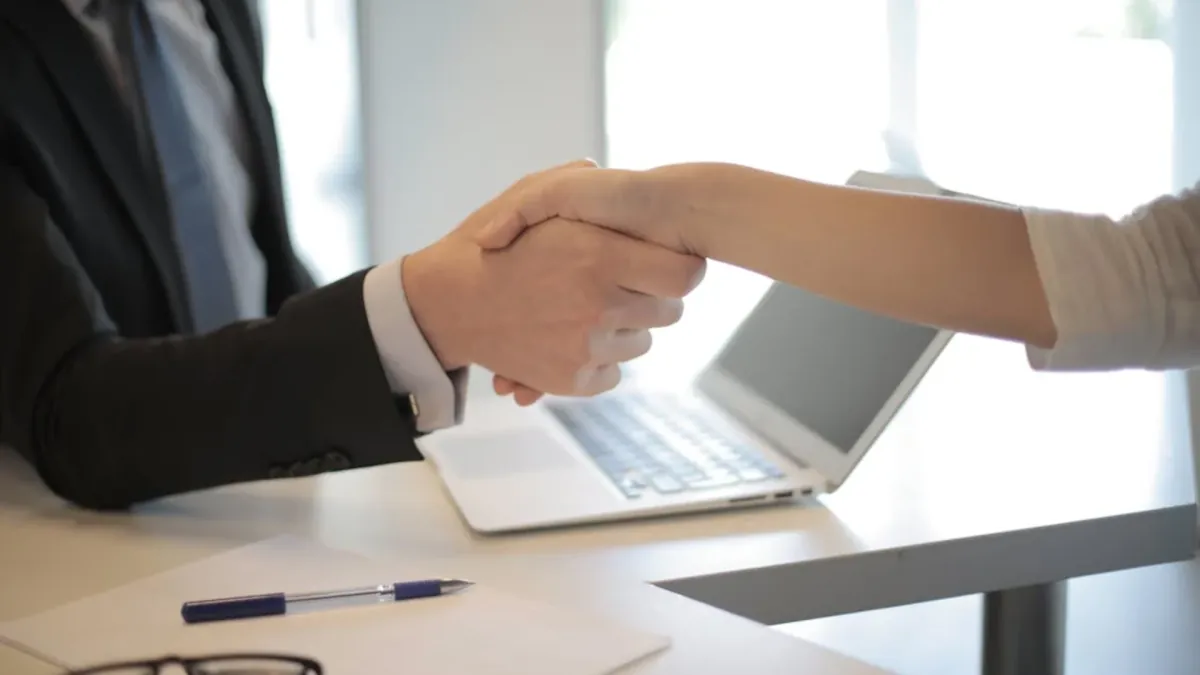 Partnership handshake between EssingtonITS and a customer